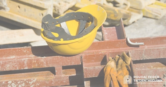 a construction hard hat and gloves